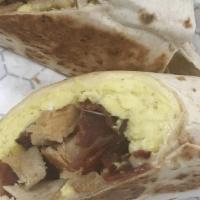 Completa Wrap · Two eggs any style, choice of ham or bacon, tostada in a wrap.