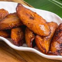 Fried Plantains · These sweet ripe plantains are sliced and fried to perfection, leaving them crisp on the out...