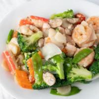 Seafood Delight · Scallop, jumbo shrimp, lobster, and crab meat with vegetables in white sauce.