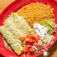 Enchiladas Suizas · Three chicken enchiladas topped with green sauce, lettuce, tomatoes, sour cream, with guacam...