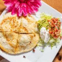 Quesadilla Azteca · A 10 inch flour tortilla, stuffed with chicken and chorizo (Mexican pork Sausage). Grilled w...