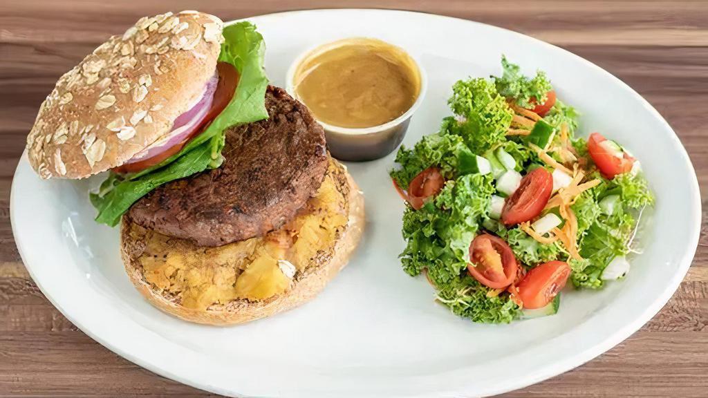 The Beyond Burger (Plant Base Burger) · A Plant Based Burger served with Lettuce, Red Onions, Tomato, Mash Sweet Plantain and our Mustard Aioli Sauce on a Multigrain Bun