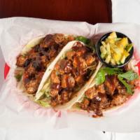Jerk Chicken Taco · Three soft tortilla, lettuce, grilled peppers and onions, tomatoes, spicy mango chutney, top...