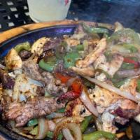 Fajitas Texanas · Grilled steak, chicken & shrimp.