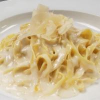 Fettuccine Alfredo · Fettuccine Tossed in emulsified Butter and Parmesan Cheese with flavor from Cream