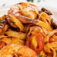 Fettuccine Mari E Monti · Sautéed Mushrooms, Baby Octopus and Shrimps in a Fresh Tomato Sauce