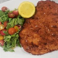 Chicken Milanese · Herb Breaded Chicken Breast served with Arugula, Shaved Parmesan and Cherry Tomatoes