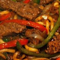 Jamaican Pepper Steak · Savory beef chunks spiced with Judy’s special seasonings in a rich brown stew gravy with sti...