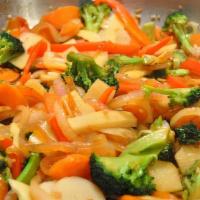 Veggie Stir Fry · Sautéed vegetables with a hint of soy sauce and garlic, rice and peas or Jasmine rice and tw...