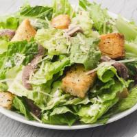 Caesar Salad · Romaine lettuce with Caesar dressing, shredded parmesan and crisp croutons.