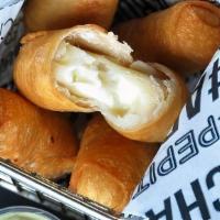 Tequenos · Venezuelan spear of bread dough with queso blanco in the middle