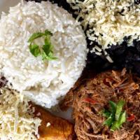 Pabellón Criollo · Traditional venezuelan dish: white rice, black beans, fried plantains and shredded beef.