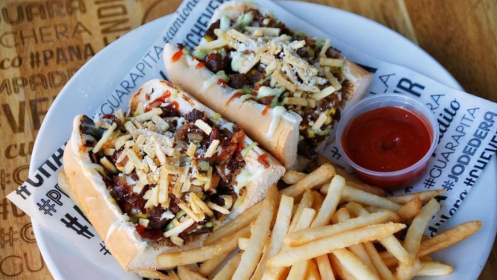 Pepito De Churrasco · Classic Venezuelan street sandwich with the grilled protein inside plus potato sticks, Parmesan cheese, and doggis sauces. Served with fries.