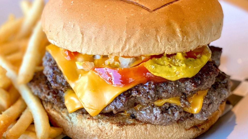 Double Cheeseburger · Two smashed beef patties melted American cheese, chopped onions, mustard and ketchup.