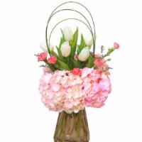 Tulip Arch · Lasting hydrangea arrangement in a lovely vase. Tulips and hydrangeas make an elegant match ...