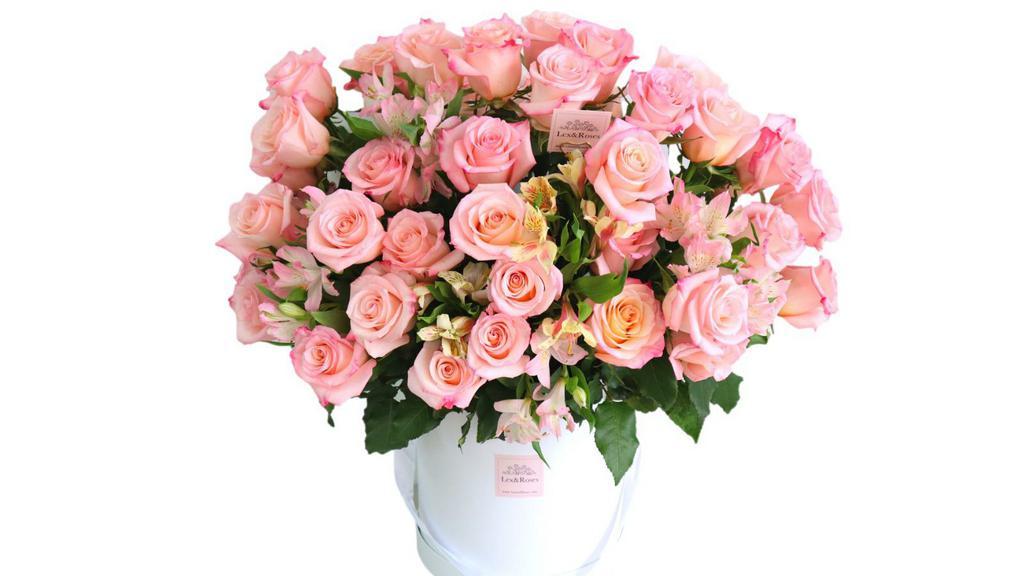  50 Pink Roses · One of our BIGGEST arrangements! Luxury box filled with Premium long stem pink  Roses! 

 50 Pink Roses.