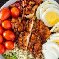 Blaqhaus Cobb Salad · Romaine lettuce tossed in ranch dressing, bleu cheese crumbles, boiled egg, diced bacon, roa...