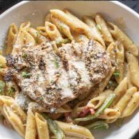 Rasta Pasta · Penne noodles tossed in Cajun jerk cream sauce with tri colored peppers and jerk chicken bre...