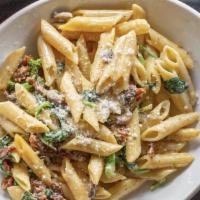Vegetarian Penne Pasta · Spinach, Sundried Tomato, Broccoli, and Mushroom sautéed in butter with a Parmesan Cream Sauce