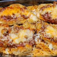 Chicken Parmiggiana · Classic, lightly breaded, and baked al forno with pomodoro sauce and cheese. Served with pas...