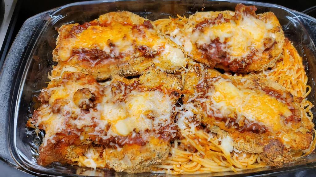 Chicken Parmiggiana · Classic, lightly breaded, and baked al forno with pomodoro sauce and cheese. Served with pasta.