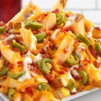 Jalapeno Pepper Fries · Cheddar cheese sauce, diced jalapeños, jalapeño lime seasoning, ranch dressing, shredded che...