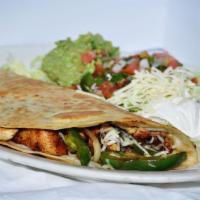 King Quesadilla · 12 inch tortilla folded, grilled, and stuffed with steak or chicken fajitas. Served with a s...