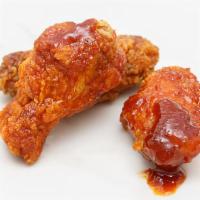 Boneless Wings · Tasty traditional boneless wings with a side of sauce.