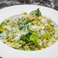 Caesar Salad · Romaine lettuce, Caesar dressing, Parmesan cheese.