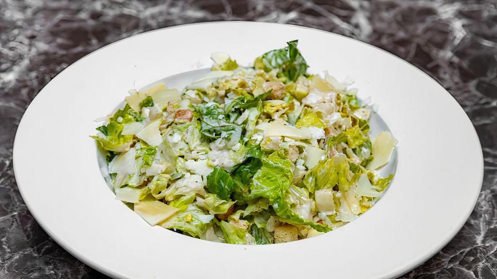 Caesar Salad · Romaine lettuce, Caesar dressing, Parmesan cheese.