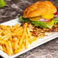 Chicken Sandwich · Grilled chicken breast, French fries, lettuce, tomato, onion, pickles.
