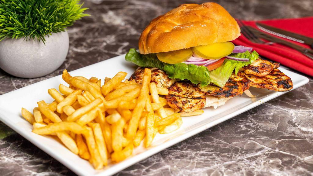 Chicken Sandwich · Grilled chicken breast, French fries, lettuce, tomato, onion, pickles.