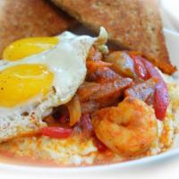 Southern Comfort · Shrimp sauteed with onions and peppers in a shrimp broth. Served over grits and topped with ...