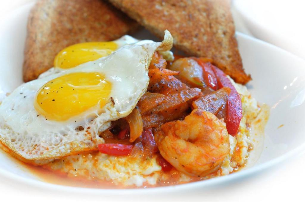 Southern Comfort · Shrimp sauteed with onions and peppers in a shrimp broth. Served over grits and topped with scrambled eggs.