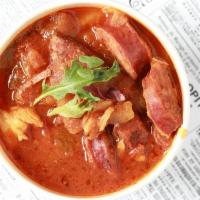 Jambalaya · A hearty chicken and andouille sausage stew served with rice.