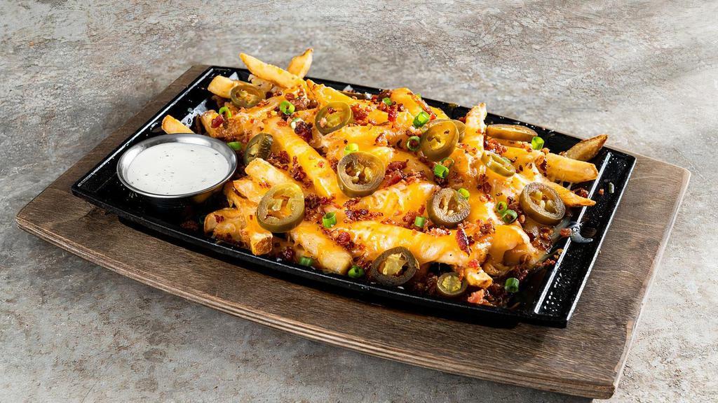 Texas Cheese Fries - Full · Shredded cheese, bacon, jalapeños, green onions. Served with house-made ranch.