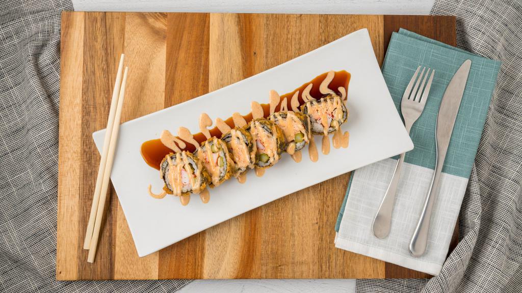 Dynamite Roll · Salmon, asparagus, crab, deep-fried roll with eel and shrimp sauce.