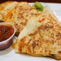 Chicken Quesadilla · Flour tortilla,  chicken, Cheddar, Mozzarella, guacamole, sour cream, and salsa.