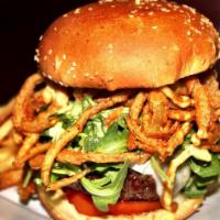Wolverine Burger · Arugula, Brie cheese, fried onion rings, and tomato topped with homemade honey mustard.