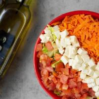 House Salad · Lettuce, diced tomatoes, carrots, and fresh mozzarella. Served with olive oil and balsamic d...