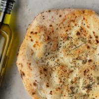 Focaccia Bread · Freshly baked focaccia bread with olive oil and Italian herbs
