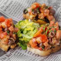 Bruschetta · Fresh bread toasted and served with diced tomatoes, basil, olive oil, and olives. Three piec...