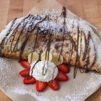 Nutella Calzone · Sweet pizza dough stuffed with Nutella and dusted with powdered sugar.