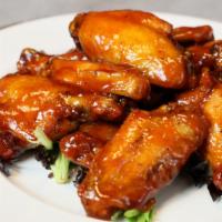 Buffalo Wings · Marinated, baked, fried, then tossed and sauced.  Available in 4 different sizes with option...
