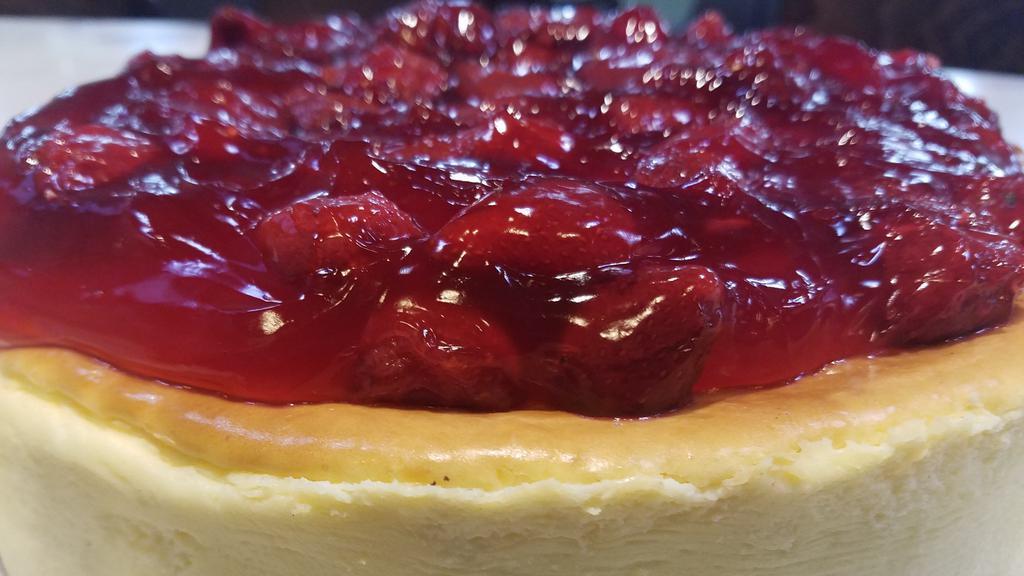 Strawberry Cheese Cake · Save room for a fresh piece of creamy cheesecake with a graham cracker crust and topped with strawberries.