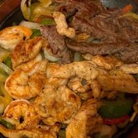 Texas Fajitas · Steak, chicken, and shrimp.