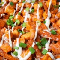 Chicken Spicy Ranch Fries · Fried Chicken bites atop a serving of fries and then drizzled with spicy ranch and buffalo s...