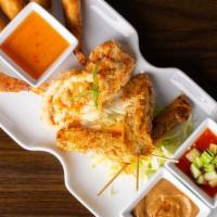 Red Elephant Platter · Combination of fried calamari, spring rolls (2), chicken satay (3), and fried shrimp (2).