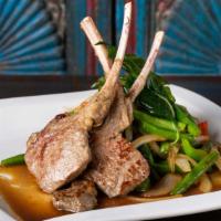 Lamb Basil · Grilled rack of lamb topped with spicy basil sauce, bell pepper, onion, and green bean. Serv...