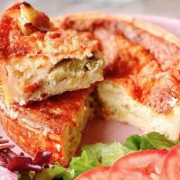Mushroom & Goat Cheese Onions Quiche · Served with salad, tomatoes and vinaigrette.